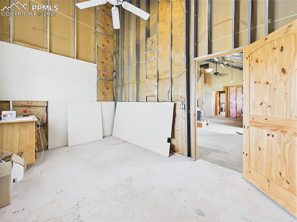 Image 20 of 50: Unfinished Room – This partially drywalled space features exposed insulatio