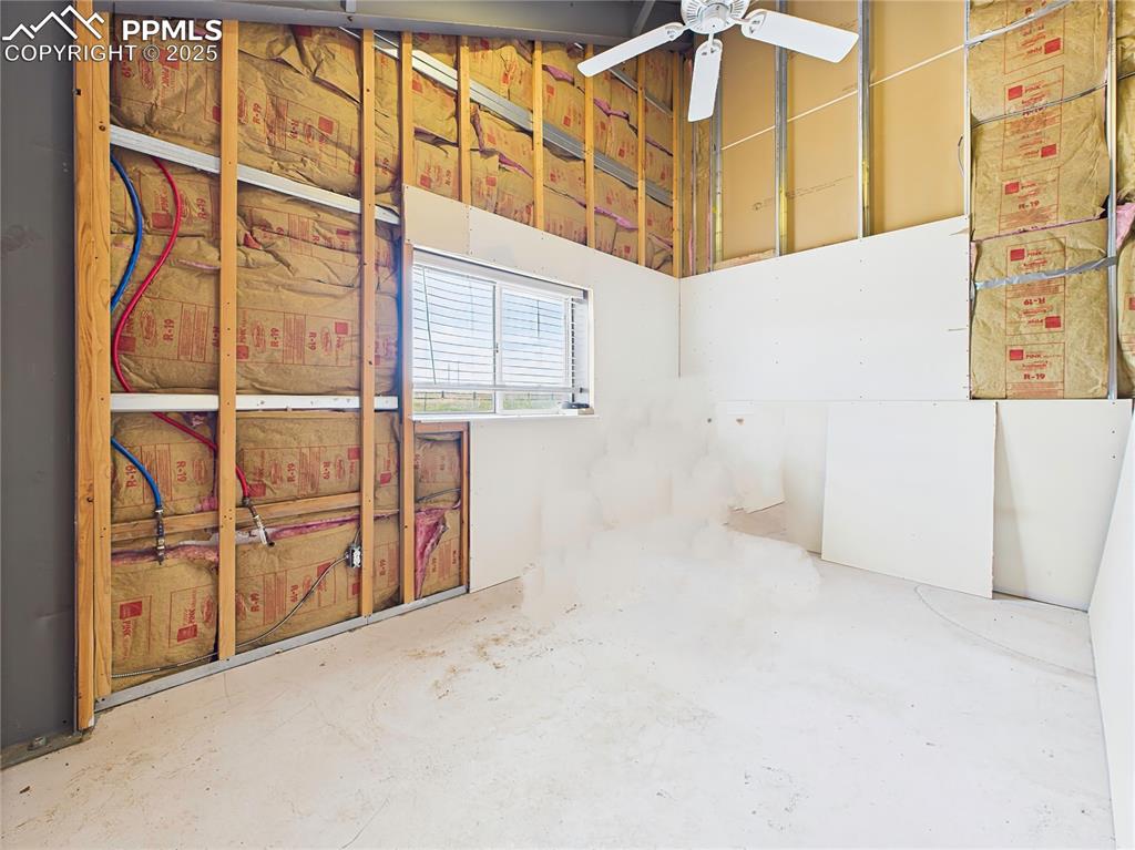 Image 21 of 50: Secondary Living Area – Multi-purpose space with visible insulation and par