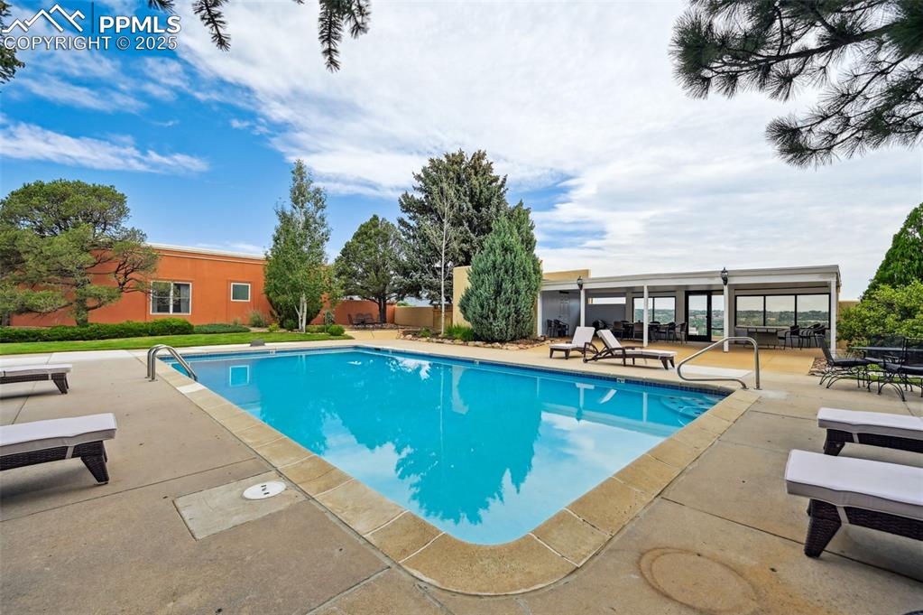 Image 26 of 32: A beautiful pool area for the residents with lounge chairs ready for sun, r