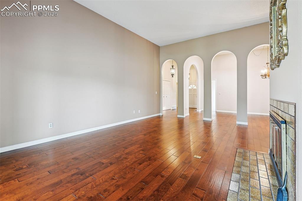 Image 7 of 32: Grand living room with high ceilings.