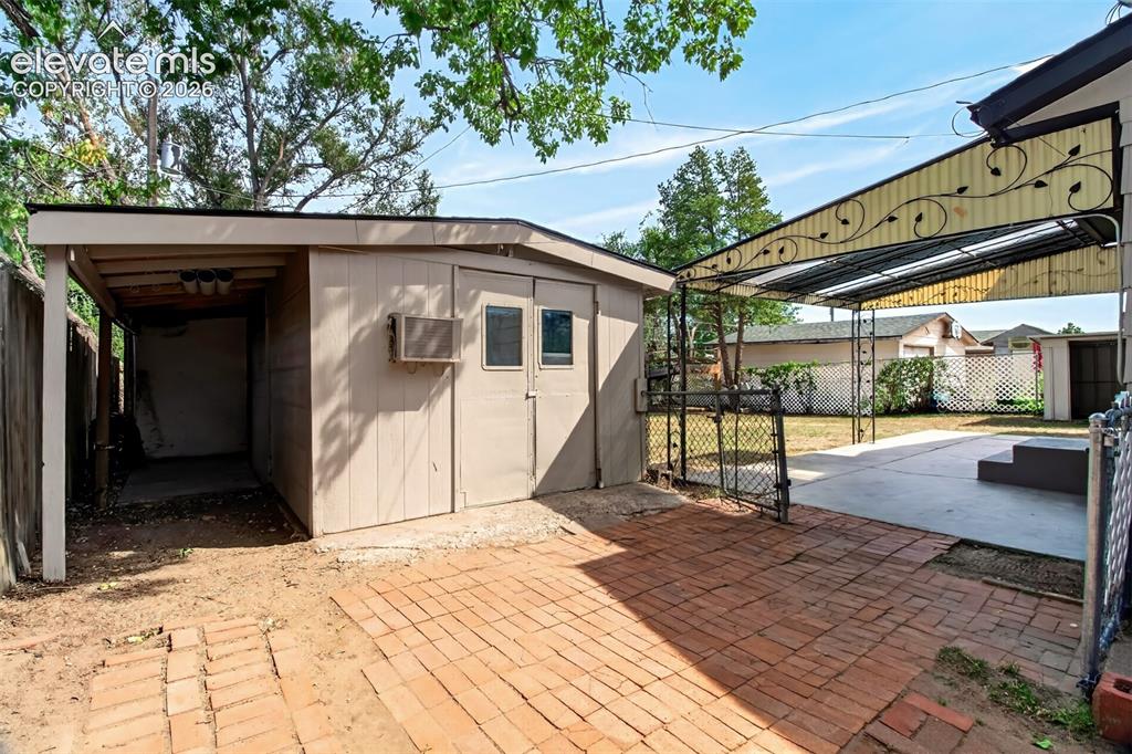 Image 27 of 38: Larger 18x10 Shed with side motorcycle parking