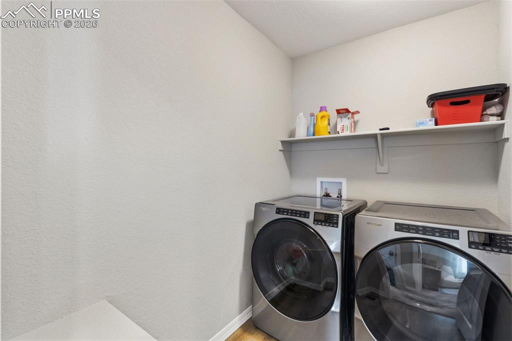 Image 21 of 30: Luandry upstairs next to main bedroom