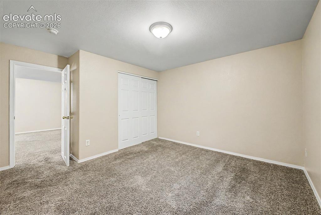 Image 26 of 32: Basement bedroom
