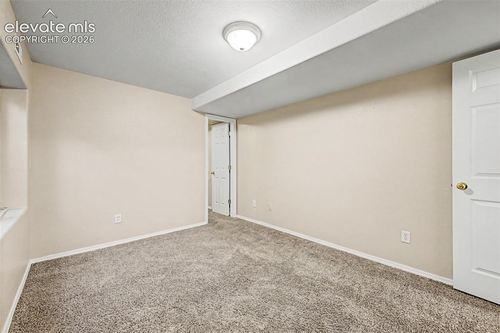 Image 28 of 32: Second basement bedroom