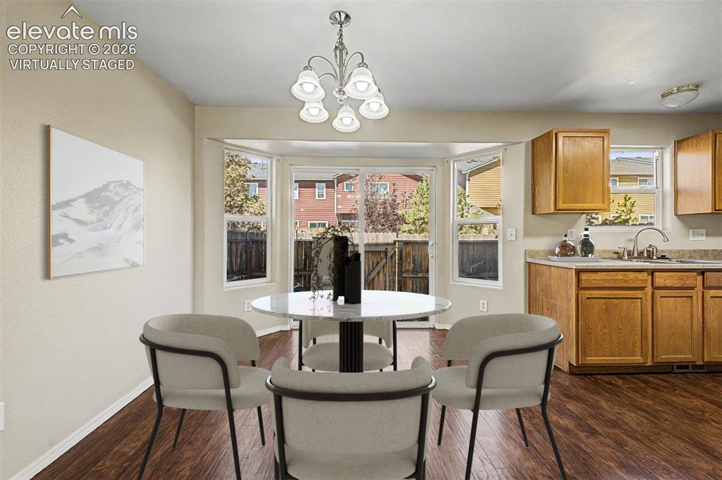 Image 8 of 32: Virtually staged dining area/eat-in kitchen