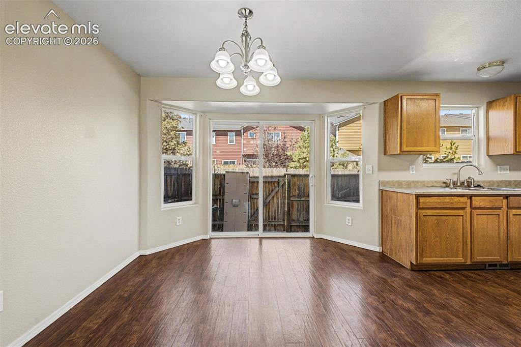 Image 9 of 32: Slider from dining room to yard