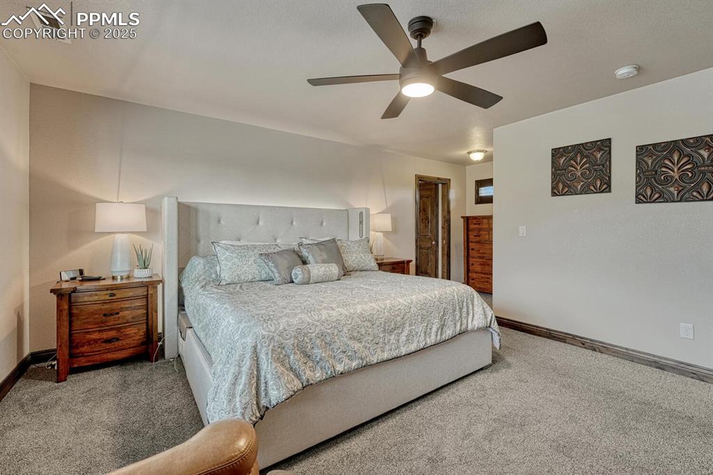 Image 26 of 50: Bedroom featuring carpet flooring, baseboards, and ceiling fan