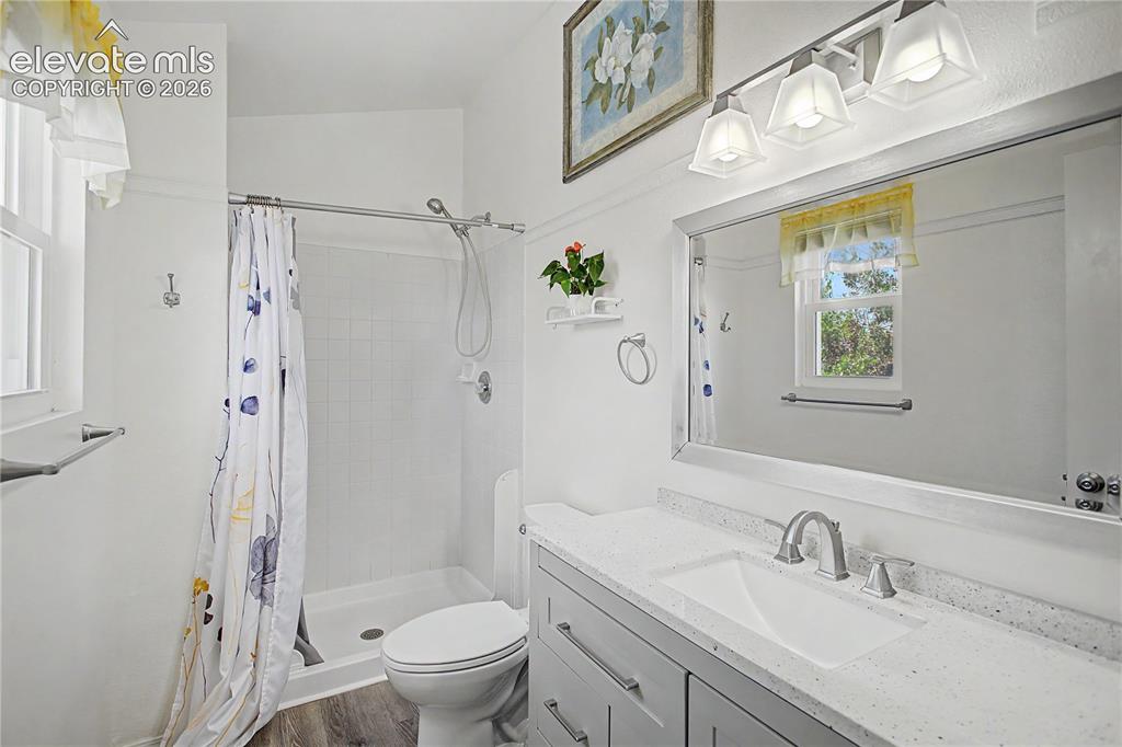 Image 16 of 40: Newer vanity and lighting