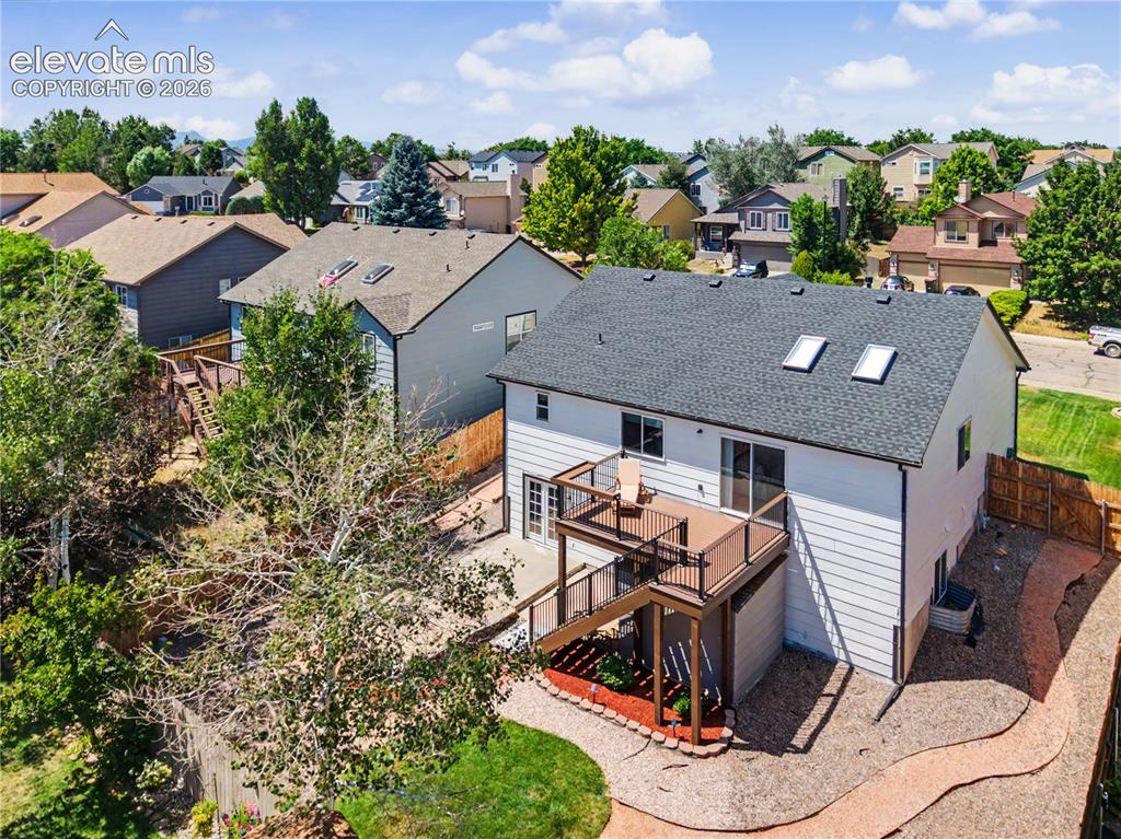 Image 36 of 40: Aerial view of backyard