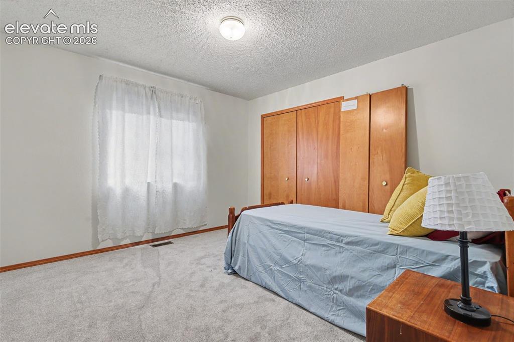 Image 17 of 31: Main level bedroom