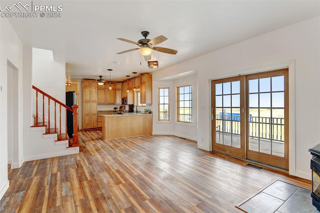 Image 13 of 45: Unfurnished living room featuring light hardwood / wood-style floors and ce