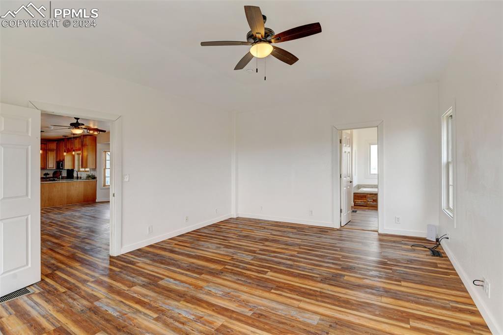 Image 15 of 45: Spare room with ceiling fan and hardwood / wood-style floors