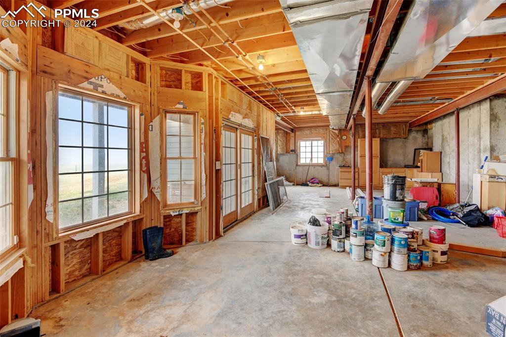 Image 29 of 45: Unfinished walk out basement w rough in