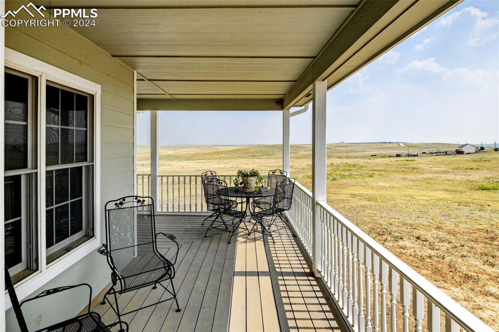 Image 3 of 45: Front deck with Mountain Views