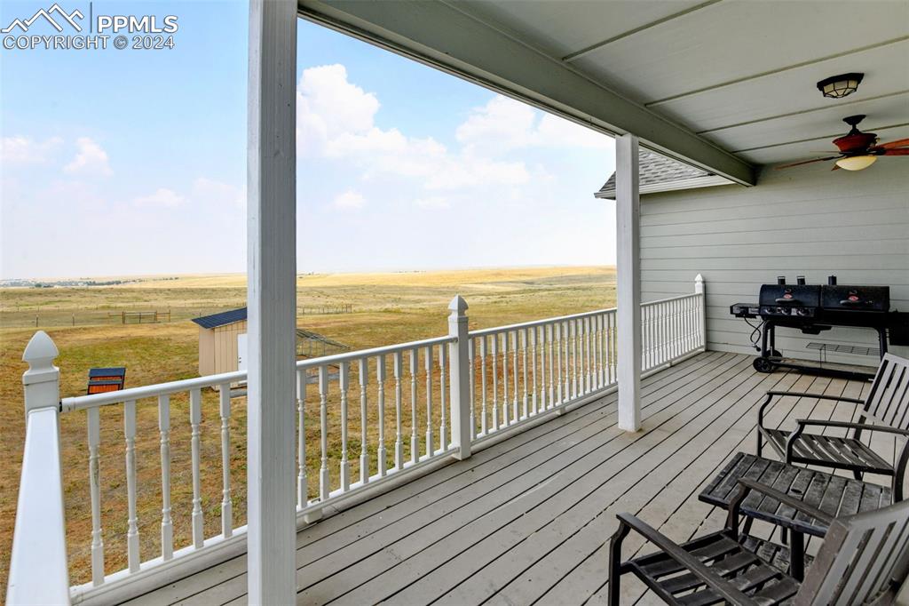 Image 30 of 45: Composite covered back deck with Bijou Basin Views.
