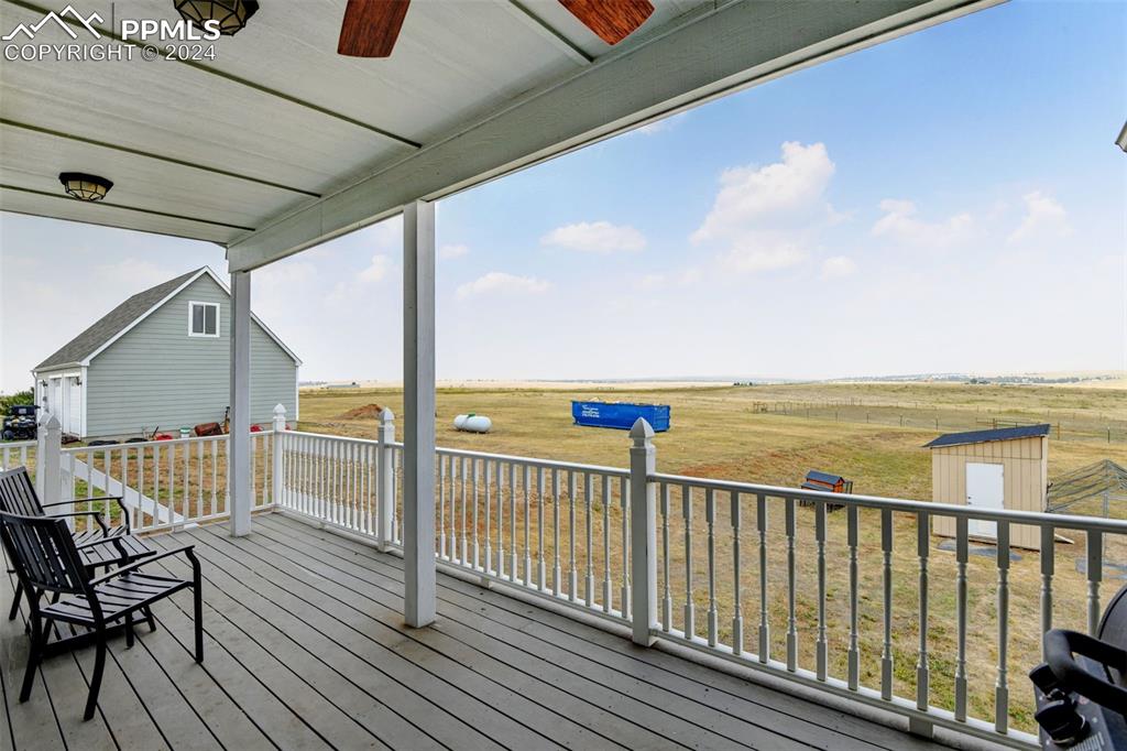 Image 31 of 45: Composite covered back deck with Bijou Basin Views.