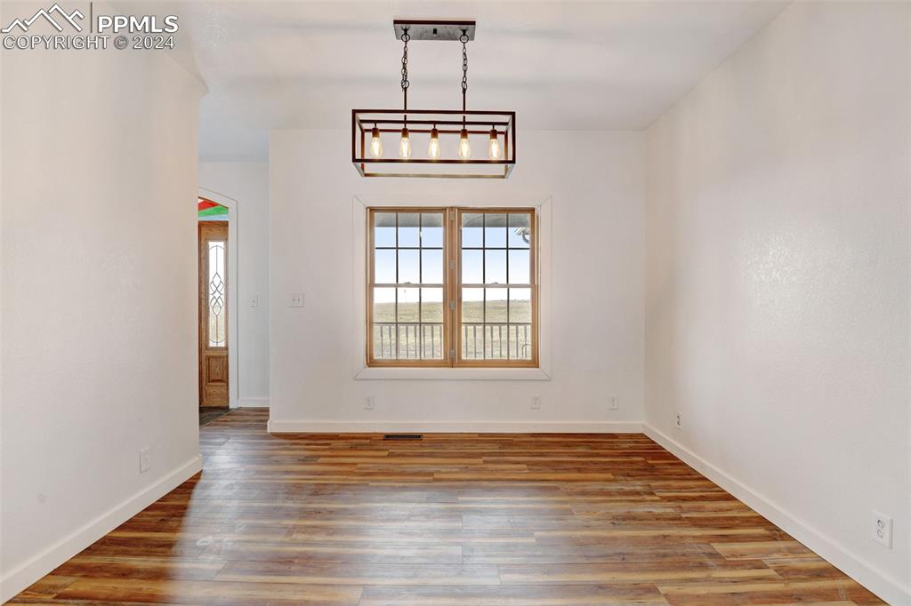 Image 9 of 45: Empty room with wood-type flooring