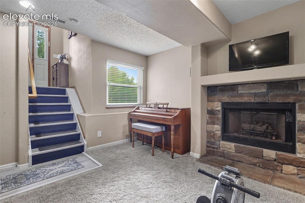 Image 8 of 34: Stone Fireplace on Lower level