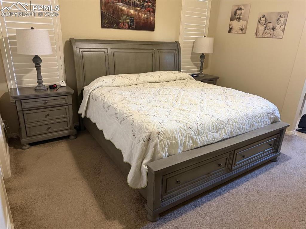 Image 11 of 25: Bedroom featuring carpet flooring