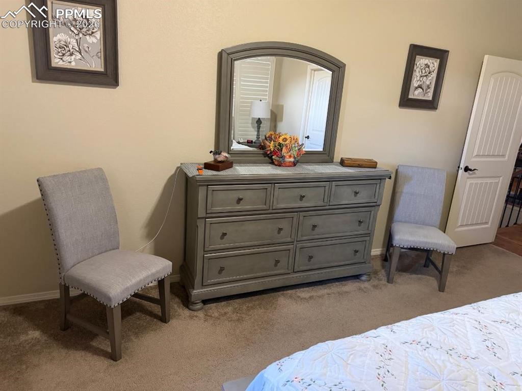 Image 12 of 25: Bedroom featuring light carpet