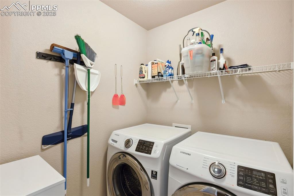 Image 14 of 30: Laundry room with washing machine and dryer