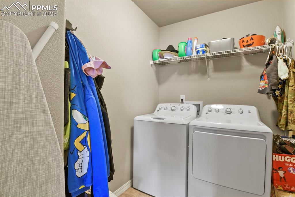Image 22 of 30: Washroom with independent washer and dryer