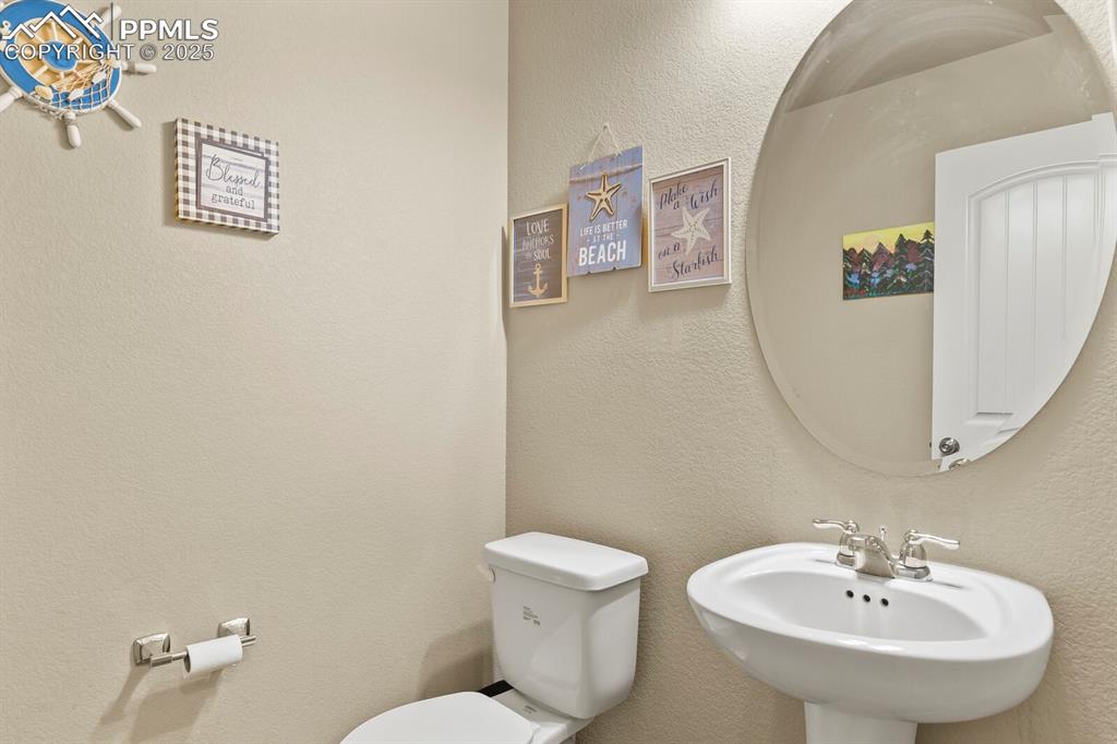 Image 6 of 30: Bathroom featuring a sink and toilet
