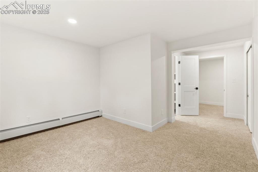 Image 33 of 43: Unfurnished room featuring light colored carpet, recessed lighting, and a b