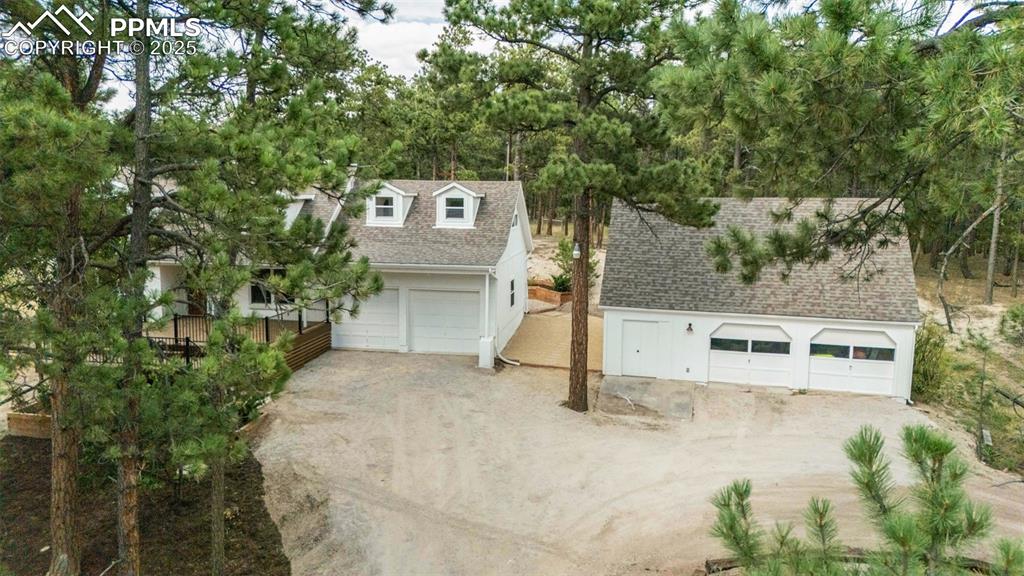 Image 38 of 43: Garage featuring a garage