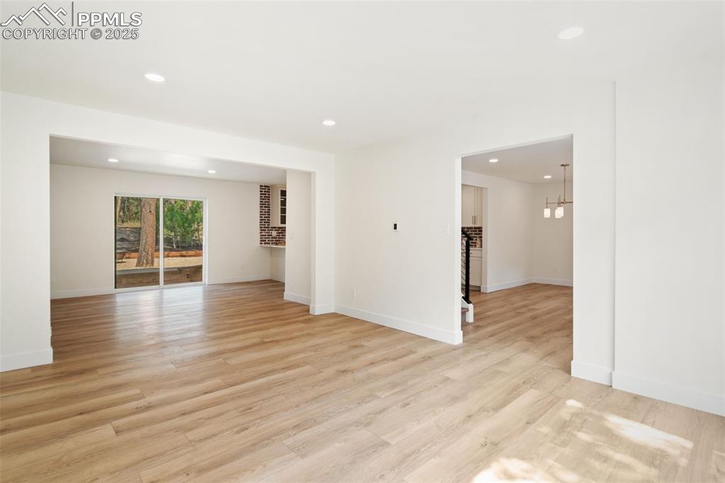 Image 9 of 43: Spare room featuring recessed lighting, a chandelier, and light wood-type f