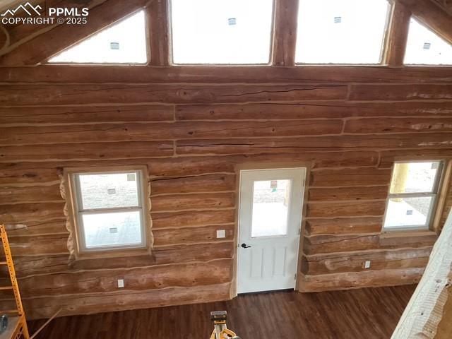 Image 28 of 28: Loft bedroom looking down over railing