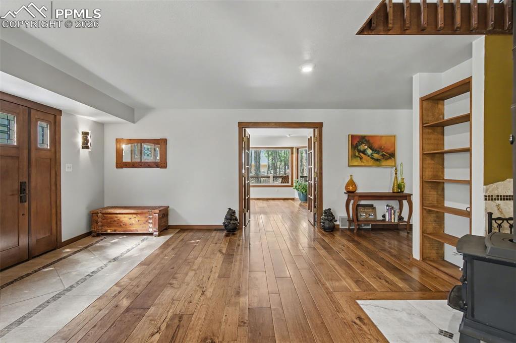 Image 11 of 50: View of main entry facing entry into the office space/formal dining, and ki