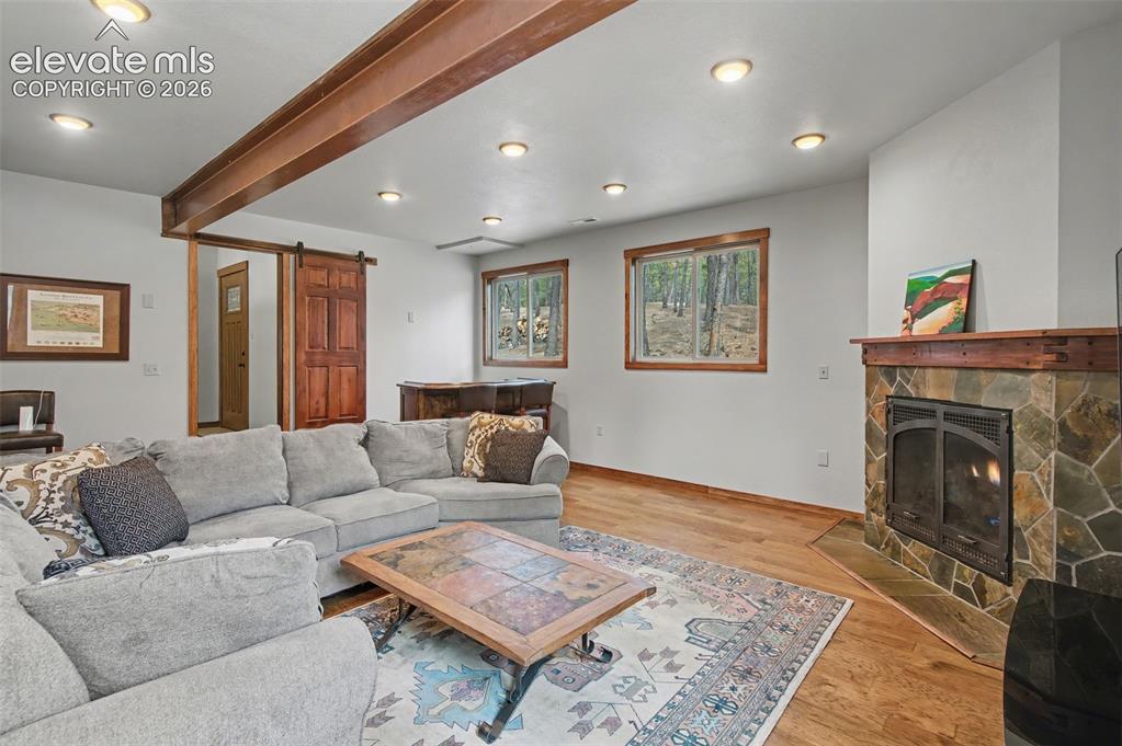 Image 22 of 50: With cozy gas fireplace!