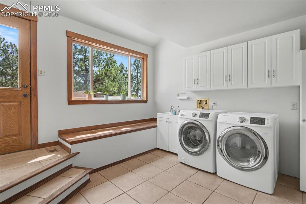 Image 23 of 50: Laundry/mudroom with side patio entry!