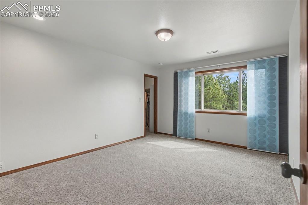 Image 33 of 50: Upper Level with walk-in closet