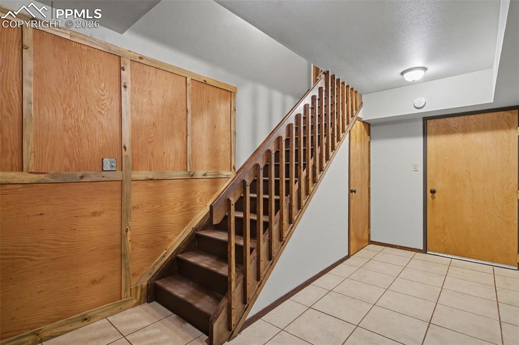 Image 44 of 50: Basement/garage entry area