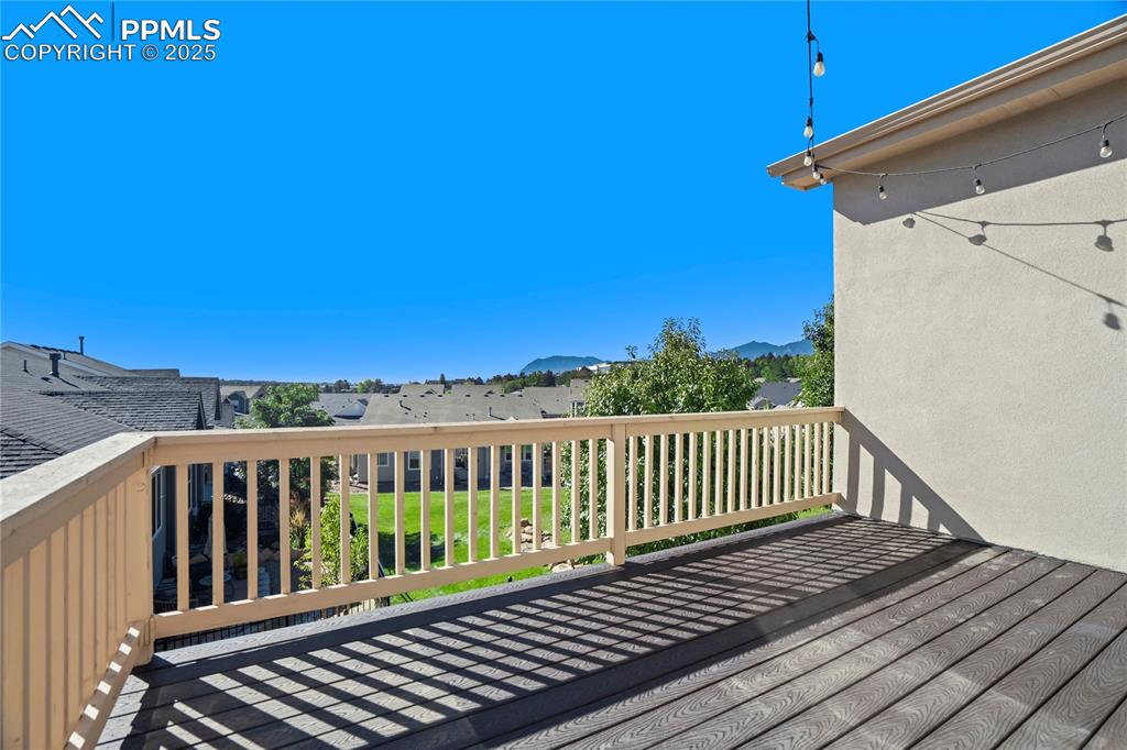 Image 13 of 44: Wooden terrace with a residential view