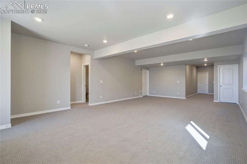 Image 43 of 44: Unfurnished room featuring recessed lighting and light carpet