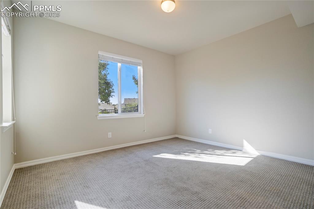 Image 44 of 44: Carpeted empty room featuring baseboards
