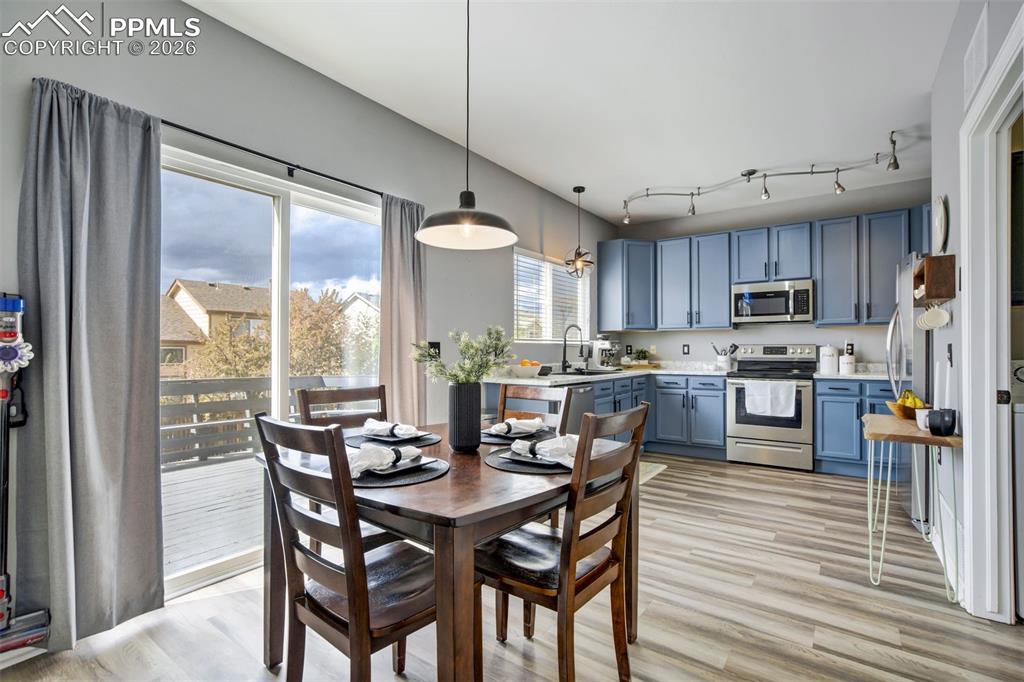 Image 13 of 42: Sliding door off the dining area leads to the epic back deck space. 
