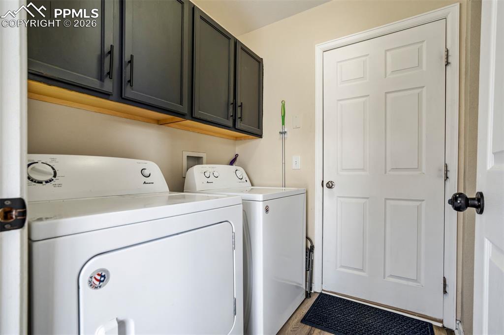 Image 17 of 42: Laundry area that leads to the garage. 