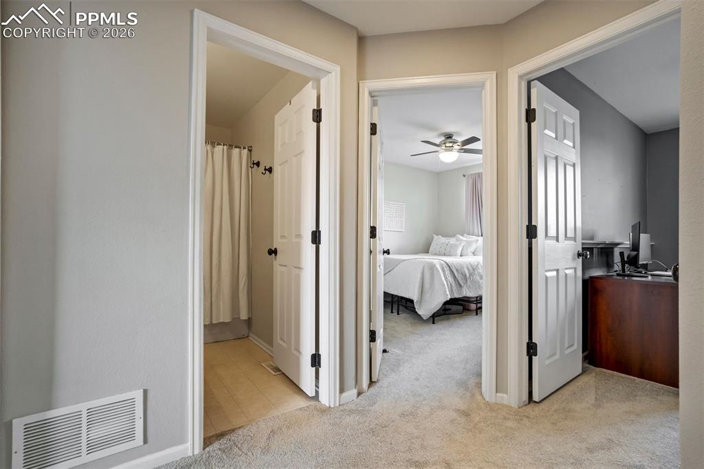 Image 36 of 42: Two additional bedrooms with another bathroom.