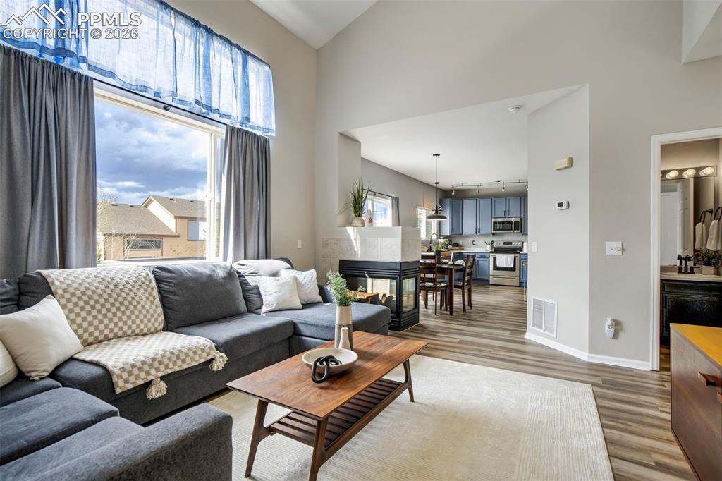 Image 4 of 42: Soaring two-story ceilings in the living room. 