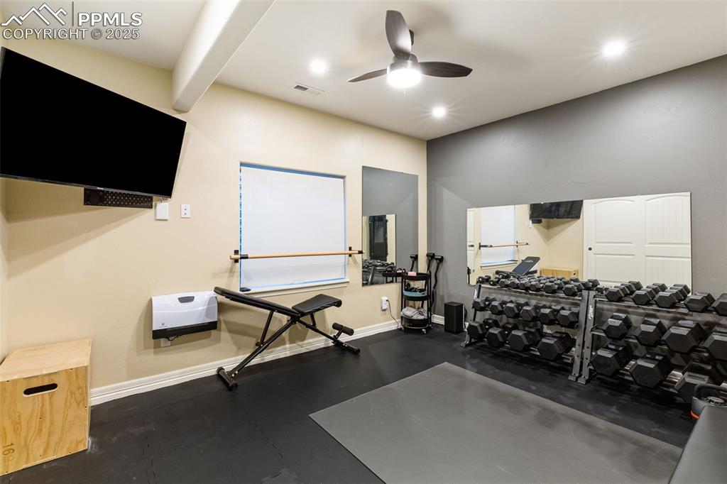 Image 31 of 37: Second basement bedroom, currently being used as workout room