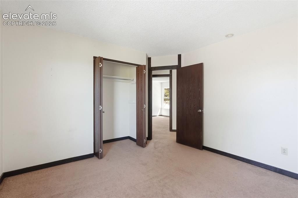 Image 35 of 50: Neutral-toned carpeting throughout