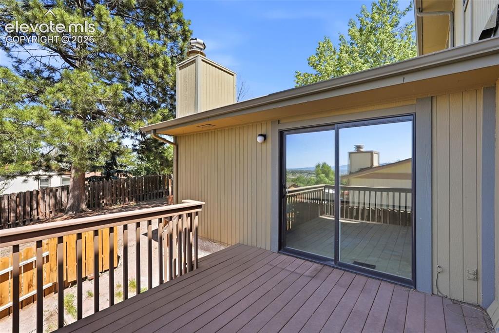Image 44 of 50: Expansive outdoor deck featuring wood-finish flooring and sturdy railings