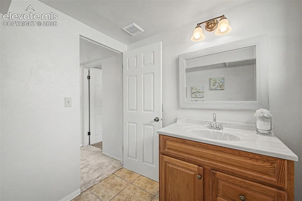 Image 17 of 37: Lower level half bathroom has room to add a corner shower (previously had o