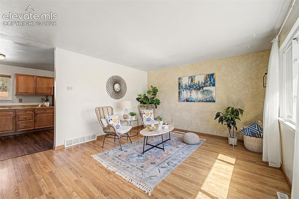 Image 2 of 37: Main floor living room filled with natural lighting