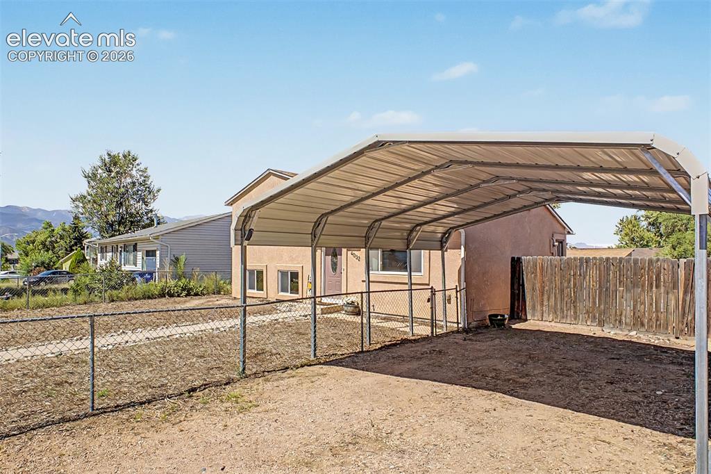 Image 26 of 37: 2 car carport and plenty of parking space