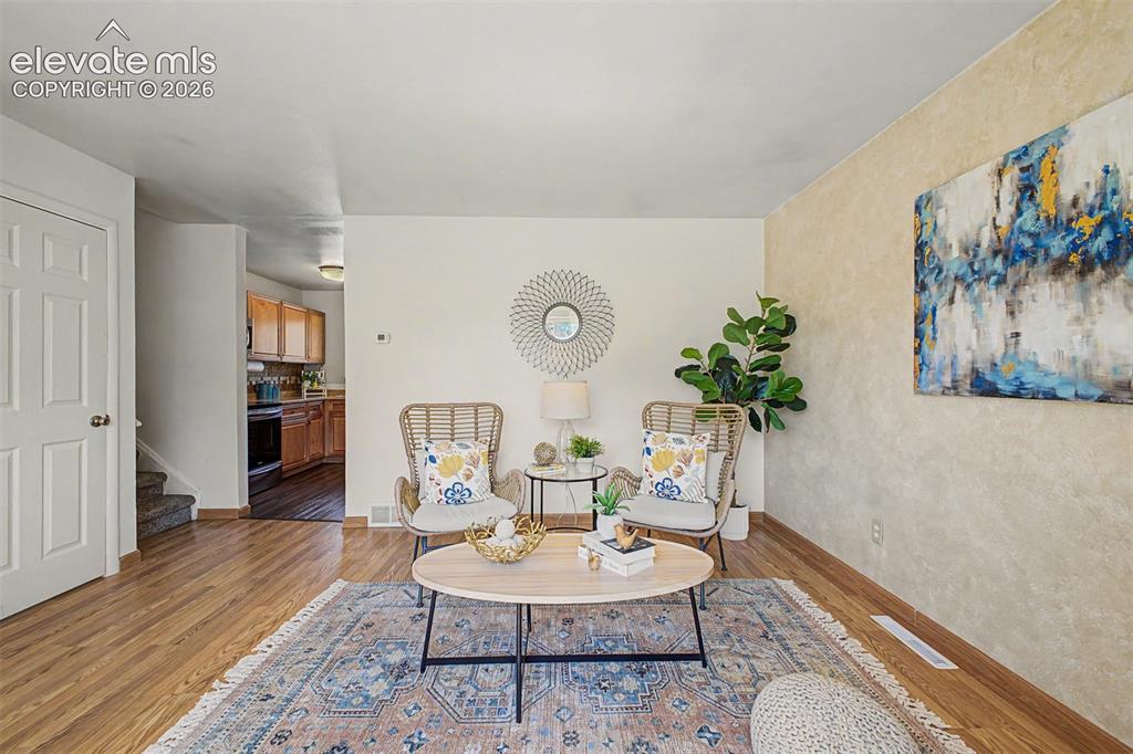 Image 3 of 37: Main floor living room filled with natural lighting
